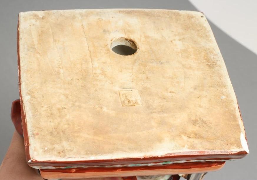 A CHINESE PORCELAIN FIGURE modelled as a celestial warrior wearing brightly coloured robes holding a Image