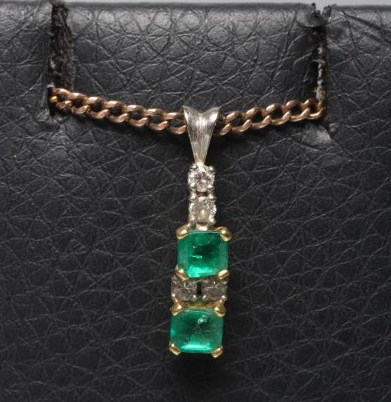AN EMERALD AND DIAMOND DROP PENDANT Image