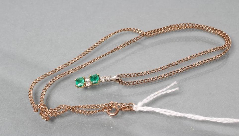 AN EMERALD AND DIAMOND DROP PENDANT Image