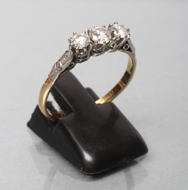 A THREE STONE DIAMOND RING Image