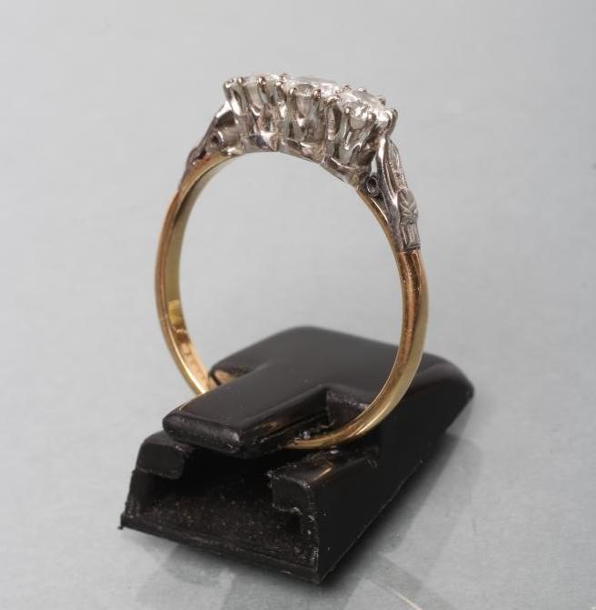 A THREE STONE DIAMOND RING Image