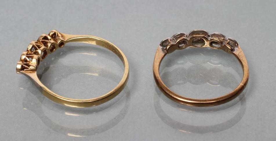 A PAIR OF ILLUSION SET FIVE STONE DIAMOND RINGS with plain shanks stamped 9ct Image