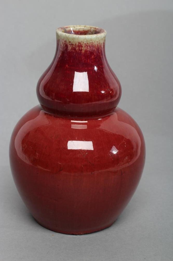 A CHINESE STONEWARE VASE of double gourd form in a sang de boeuf glaze Image