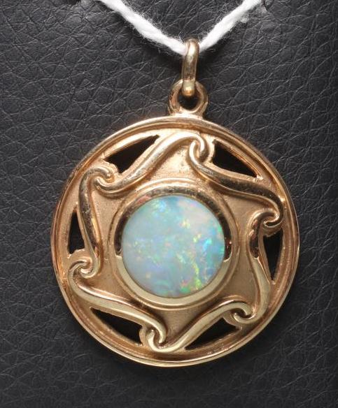 AN ARTS AND CRAFTS STYLE 9CT GOLD BOSS PENDANT centred by a close back set opal doublet(?) within a Image