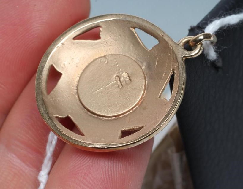 AN ARTS AND CRAFTS STYLE 9CT GOLD BOSS PENDANT centred by a close back set opal doublet(?) within a Image