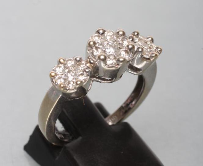 A DIAMOND TRIPLE CLUSTER RING Image