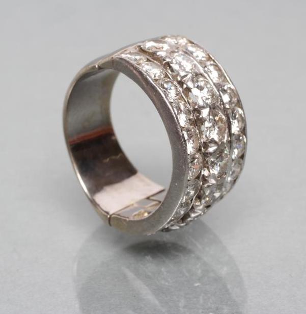 A TRIPLE ROW DIAMOND HALF HOOP RING Image