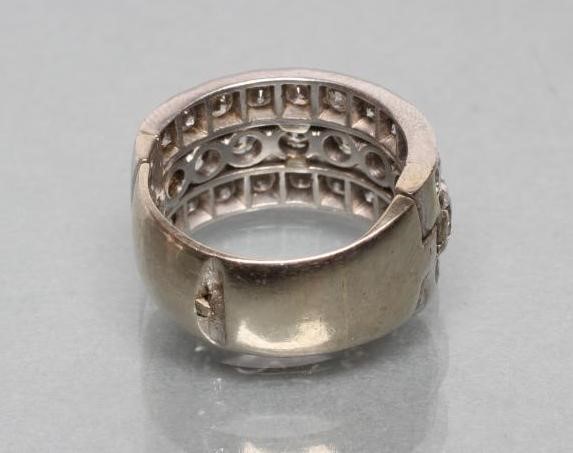 A TRIPLE ROW DIAMOND HALF HOOP RING Image