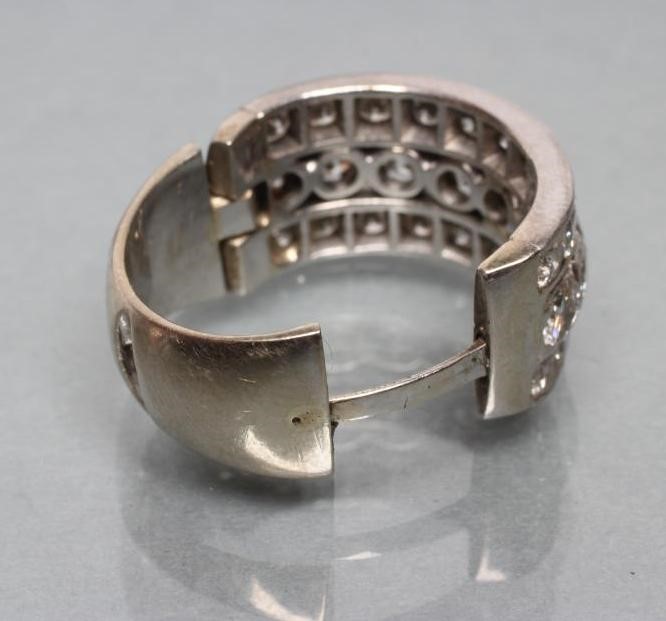 A TRIPLE ROW DIAMOND HALF HOOP RING Image