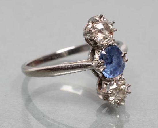 A SAPPHIRE AND DIAMOND THREE STONE RING Image
