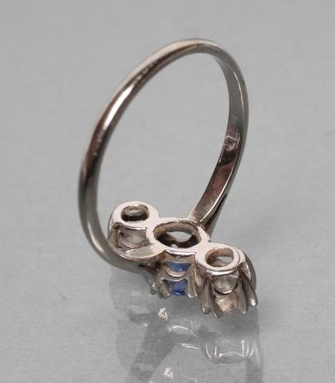 A SAPPHIRE AND DIAMOND THREE STONE RING Image