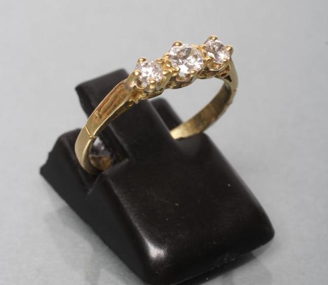 A THREE STONE DIAMOND RING Image