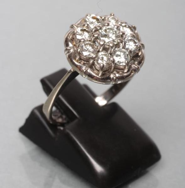 A NINE STONE DIAMOND CLUSTER RING Image