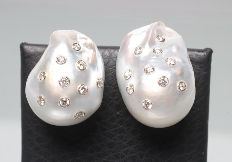 A LARGE PAIR OF BAROQUE PEARL EAR STUDS Image