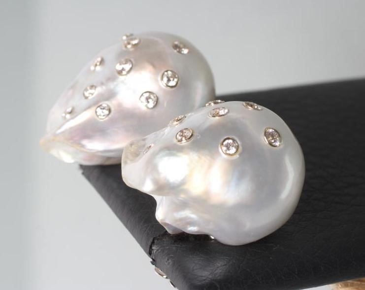 A LARGE PAIR OF BAROQUE PEARL EAR STUDS Image