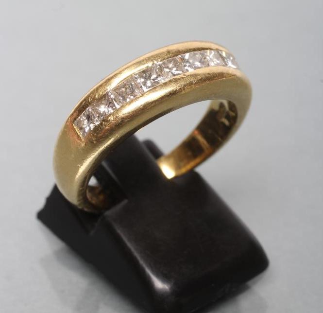 A NINE STONE DIAMOND HALF HOOP ETERNITY RING Image