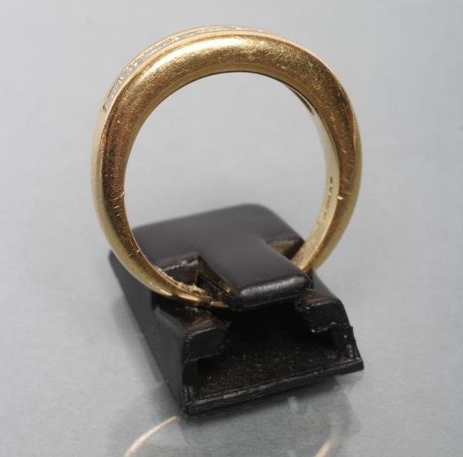 A NINE STONE DIAMOND HALF HOOP ETERNITY RING Image