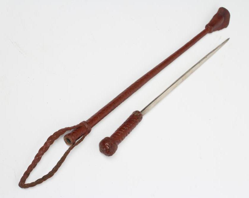 A SWORD STICK/CROP with 10 1/2" blade and braided leather shaft Image