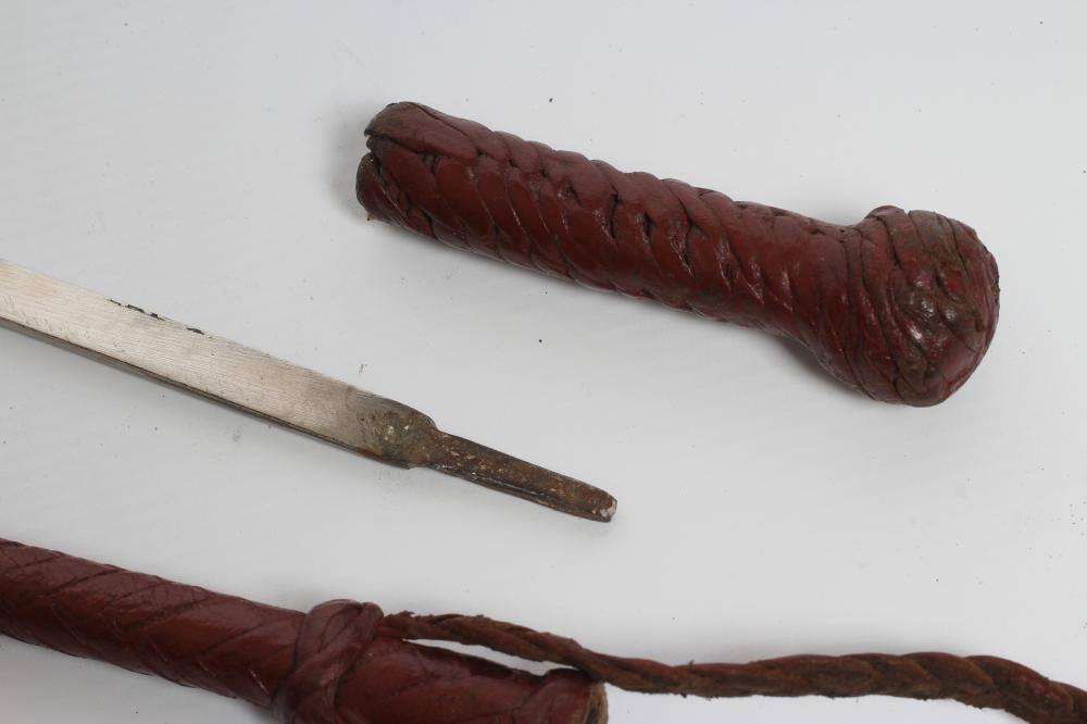 A SWORD STICK/CROP with 10 1/2" blade and braided leather shaft Image