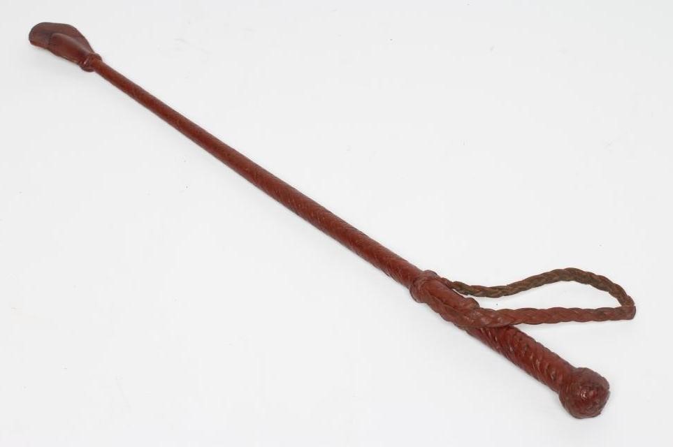 A SWORD STICK/CROP with 10 1/2" blade and braided leather shaft Image