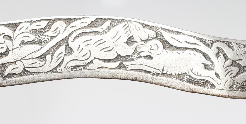 A SHAMSHIR with 26 3/4" curved blade and brass hilt with scalloped grip and lion head pommel Image