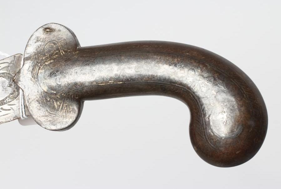 A SHAMSHIR with 26 3/4" curved blade and brass hilt with scalloped grip and lion head pommel Image