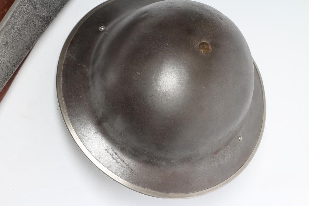 A BRITISH WWI HELMET with faux leather webbing Image