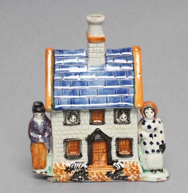 A MEXBOROUGH TYPE PRATTWARE PEARLWARE MONEY BOX Image