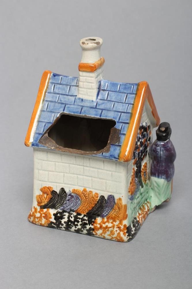 A MEXBOROUGH TYPE PRATTWARE PEARLWARE MONEY BOX Image