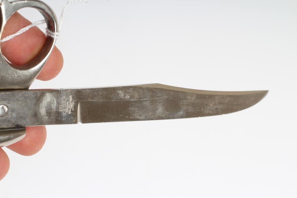 A WWI CLEMENTS KNUCKLE DUSTER KNIFE with 5" clip point blade Image