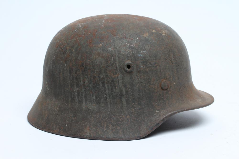 A GERMAN THIRD REICH M35 HELMET of typical form Image