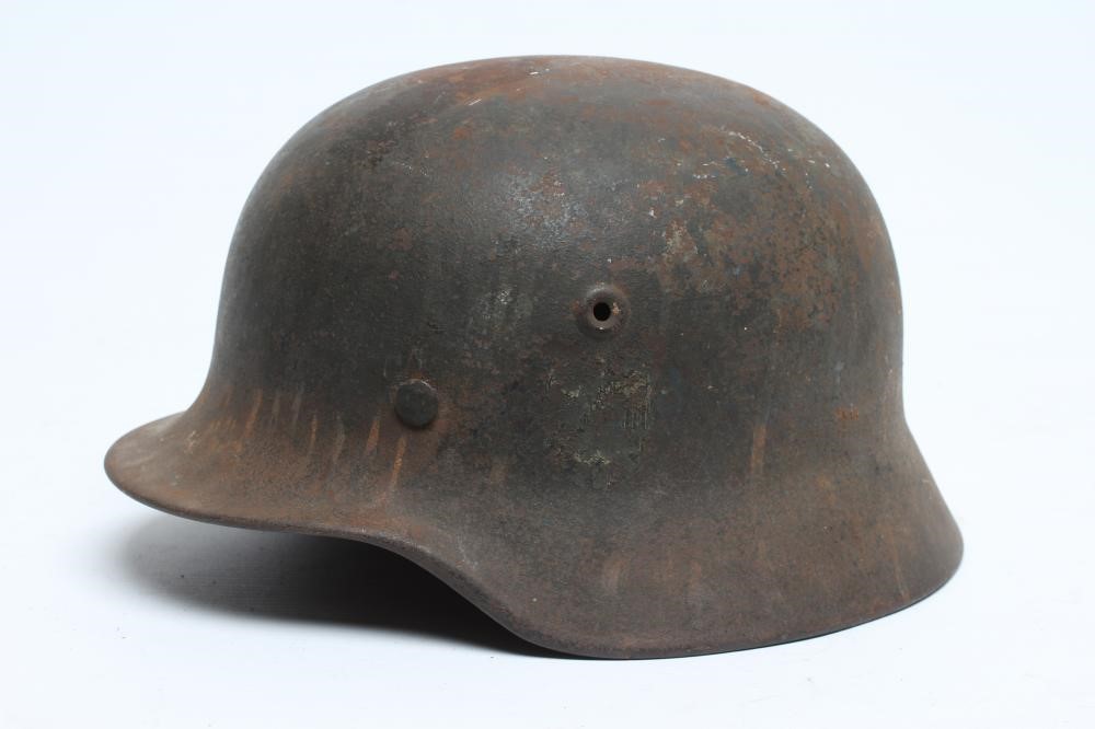 A GERMAN THIRD REICH M35 HELMET of typical form Image