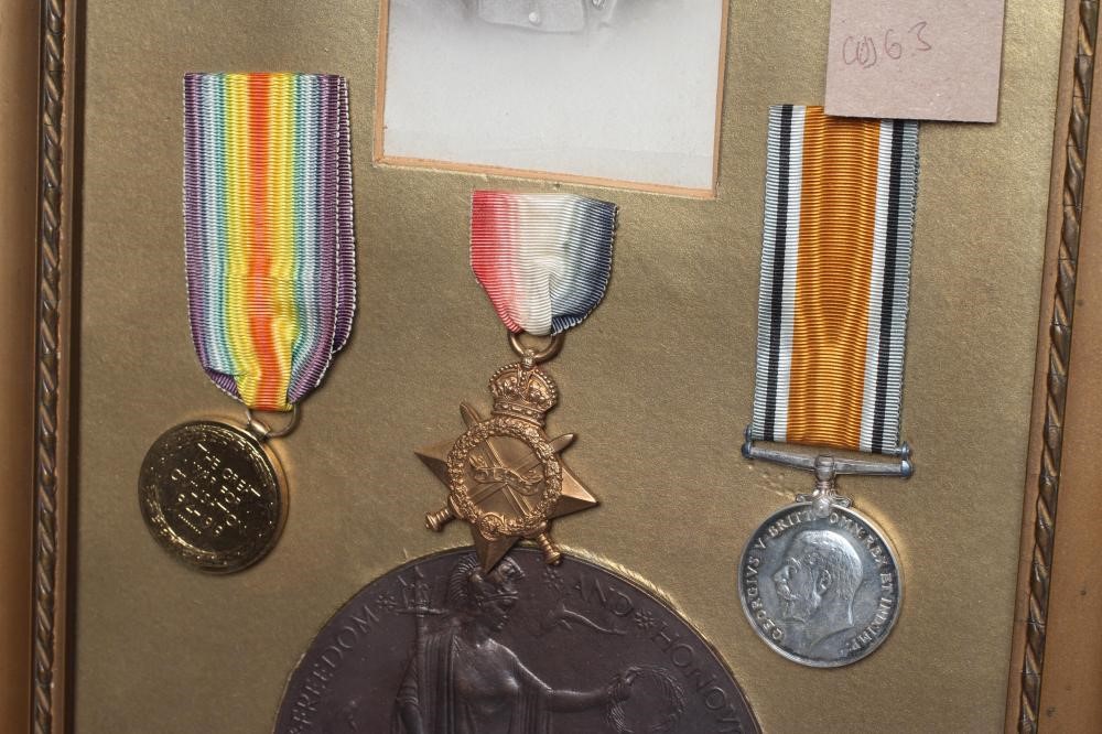 A FRAMED FAMILY OF MEDALS awarded to Bombardier Frank Clark of the Royal Field Artillery Image