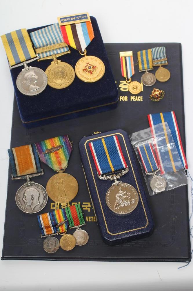 A FAMILY OF MEDALS FOR FATHER AND SON Image
