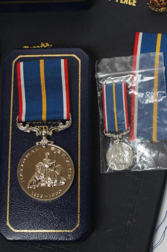 A FAMILY OF MEDALS FOR FATHER AND SON Image