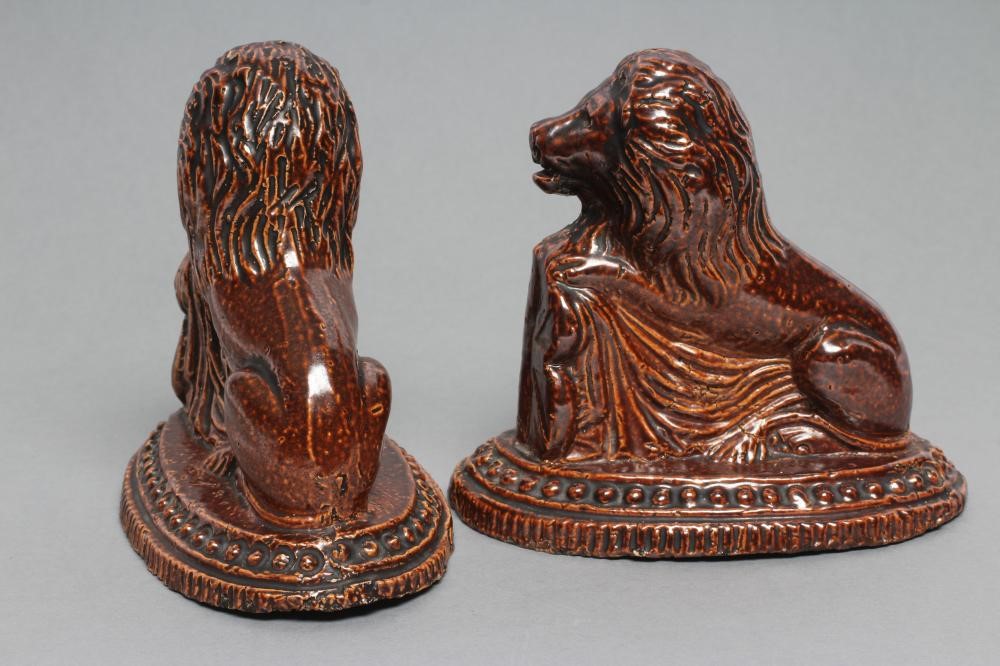 A PAIR OF BRAMPTON TYPE BROWN SALTGLAZE STONEWARE LIONS Image