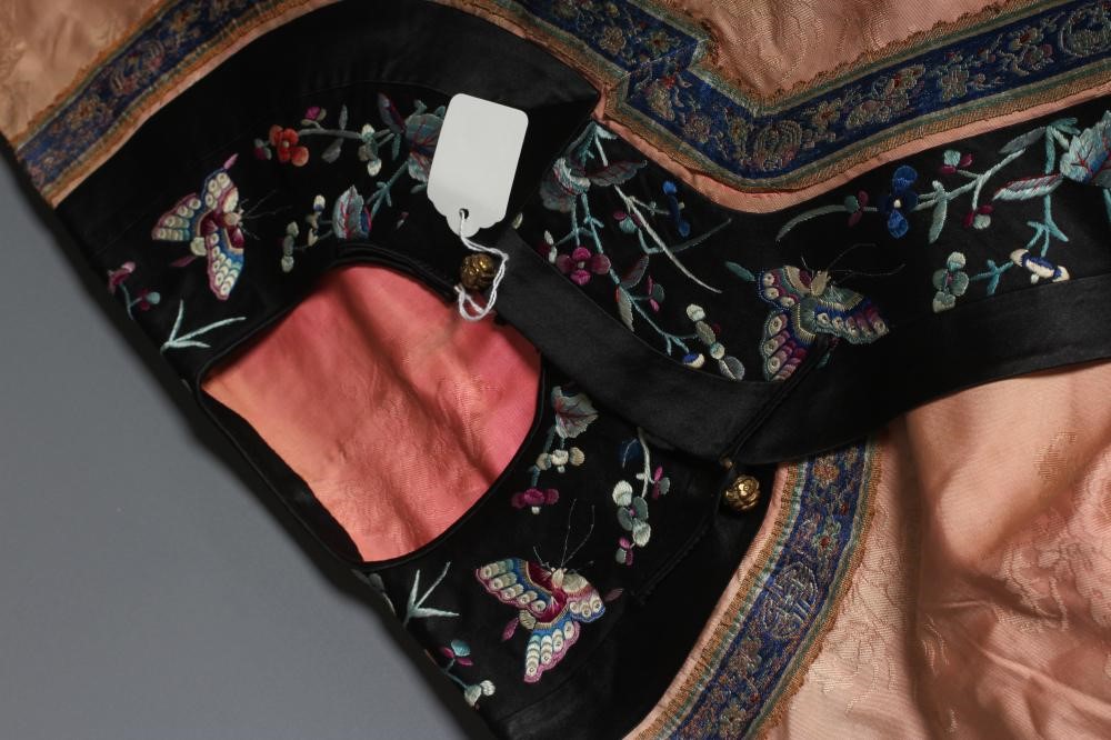 A CHINESE PINK SILK WOVEN ROBE Image