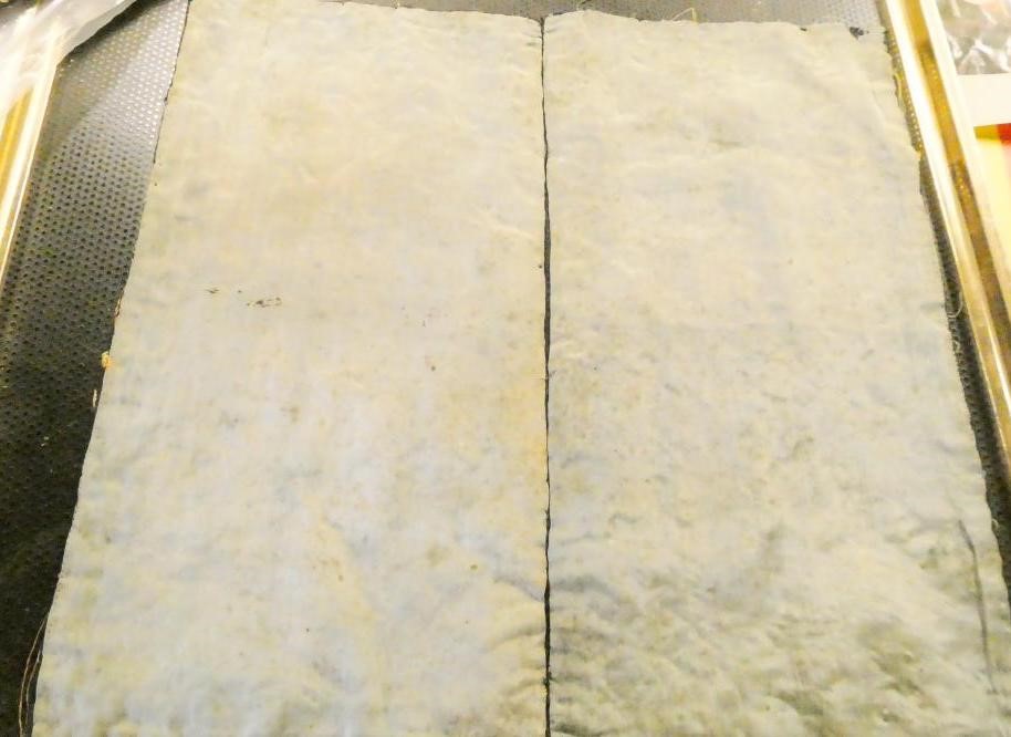 A PAIR OF CHINESE SILK SQUARE PANELS embroidered in coloured silks on a dark navy ground Image