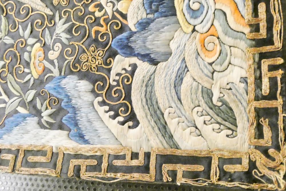 A PAIR OF CHINESE SILK SQUARE PANELS embroidered in coloured silks on a dark navy ground Image