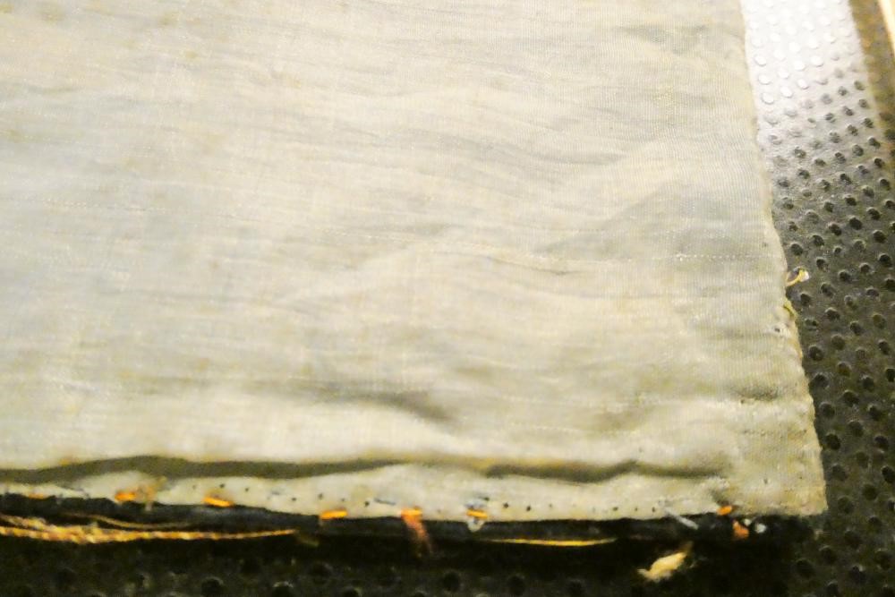 A PAIR OF CHINESE SILK SQUARE PANELS embroidered in coloured silks on a dark navy ground Image