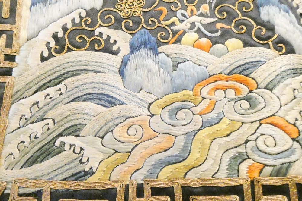 A PAIR OF CHINESE SILK SQUARE PANELS embroidered in coloured silks on a dark navy ground Image