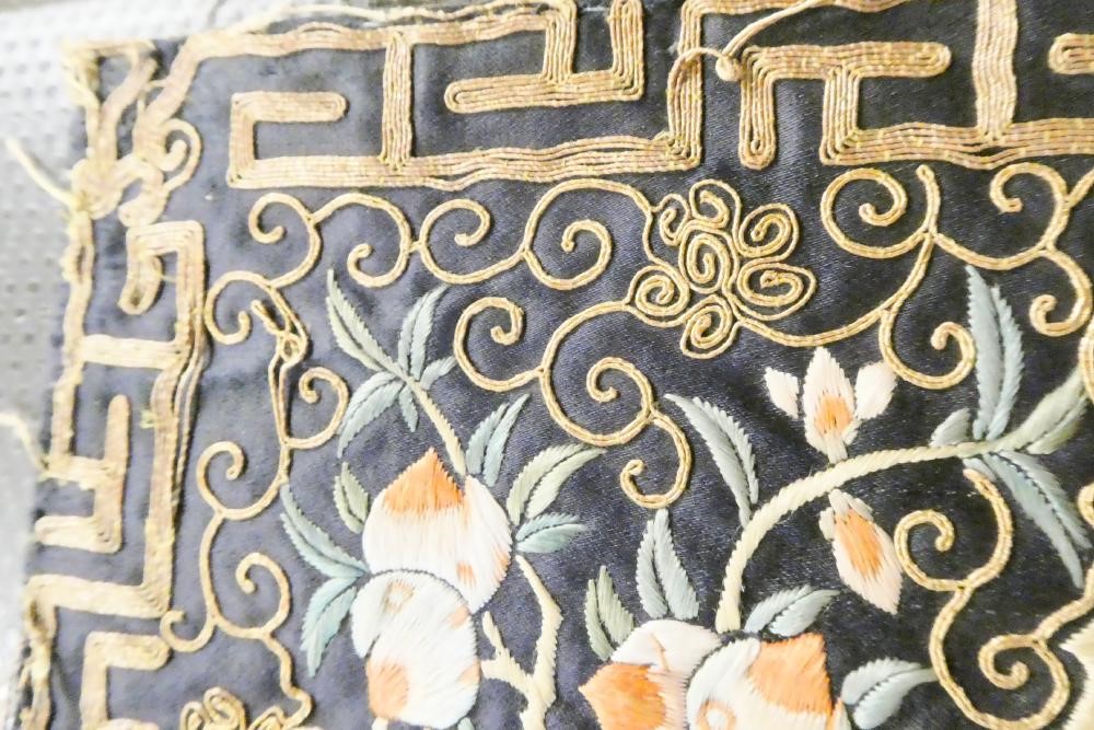 A PAIR OF CHINESE SILK SQUARE PANELS embroidered in coloured silks on a dark navy ground Image