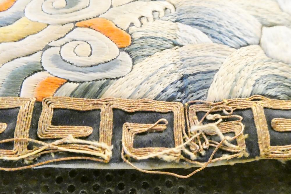 A PAIR OF CHINESE SILK SQUARE PANELS embroidered in coloured silks on a dark navy ground Image