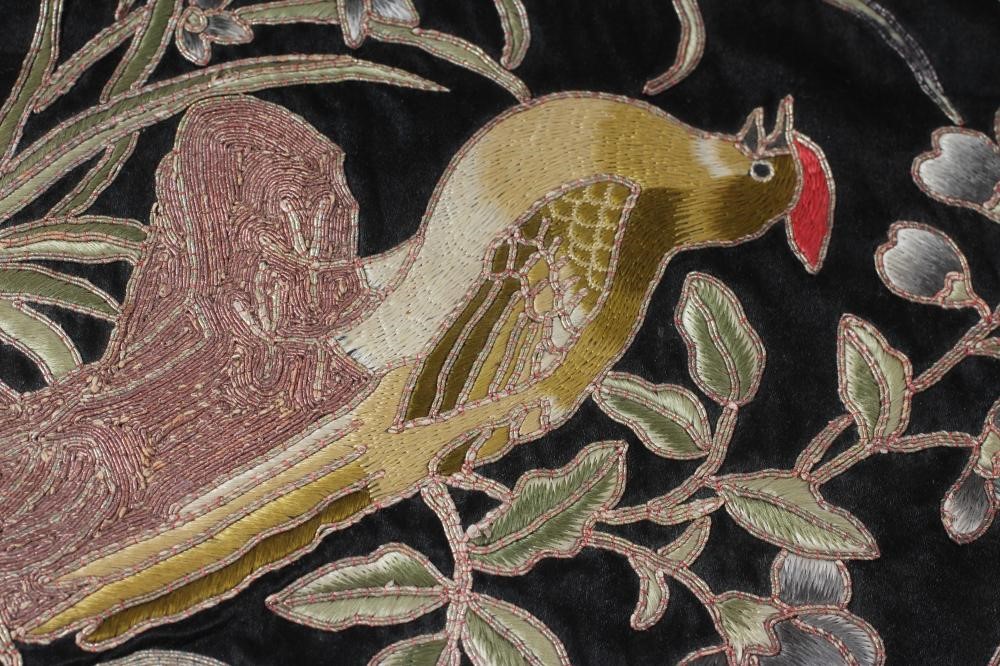 A PAIR OF CHINESE SILK SQUARE PANELS embroidered in coloured silks on a dark navy ground Image