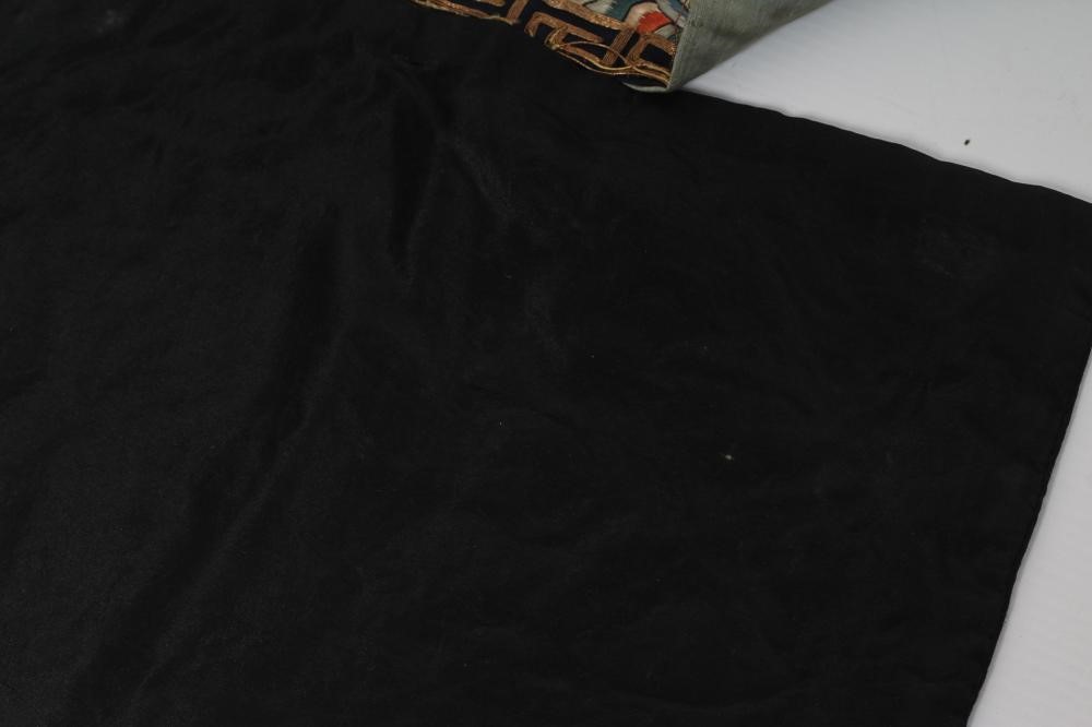 A PAIR OF CHINESE SILK SQUARE PANELS embroidered in coloured silks on a dark navy ground Image