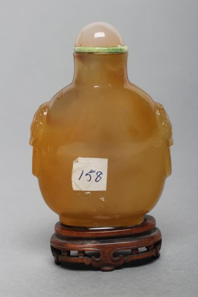 A CHINESE HONEY AGATE SNUFF BOTTLE with grey and amber cloud effect Image
