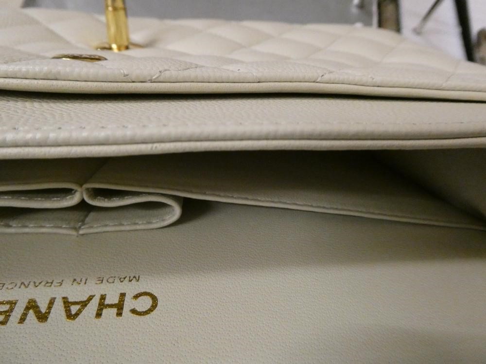 A CHANEL WHITE "CAVIAR" LEATHER QUILTED CLASSIC HANDBAG Image