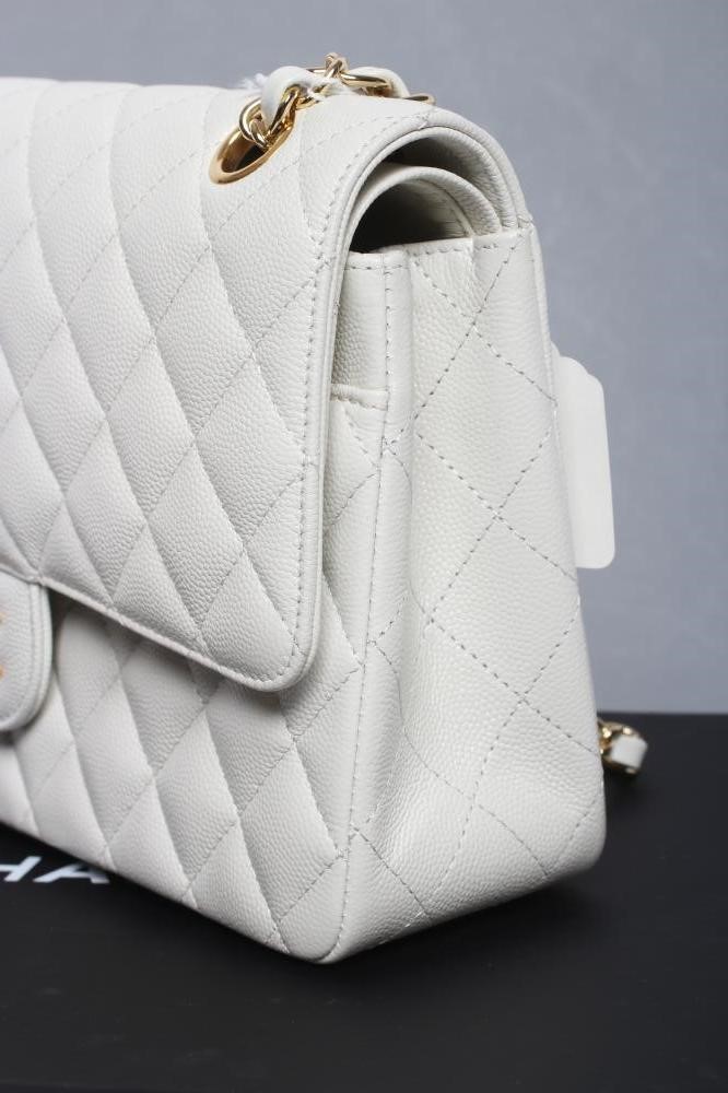 A CHANEL WHITE "CAVIAR" LEATHER QUILTED CLASSIC HANDBAG Image
