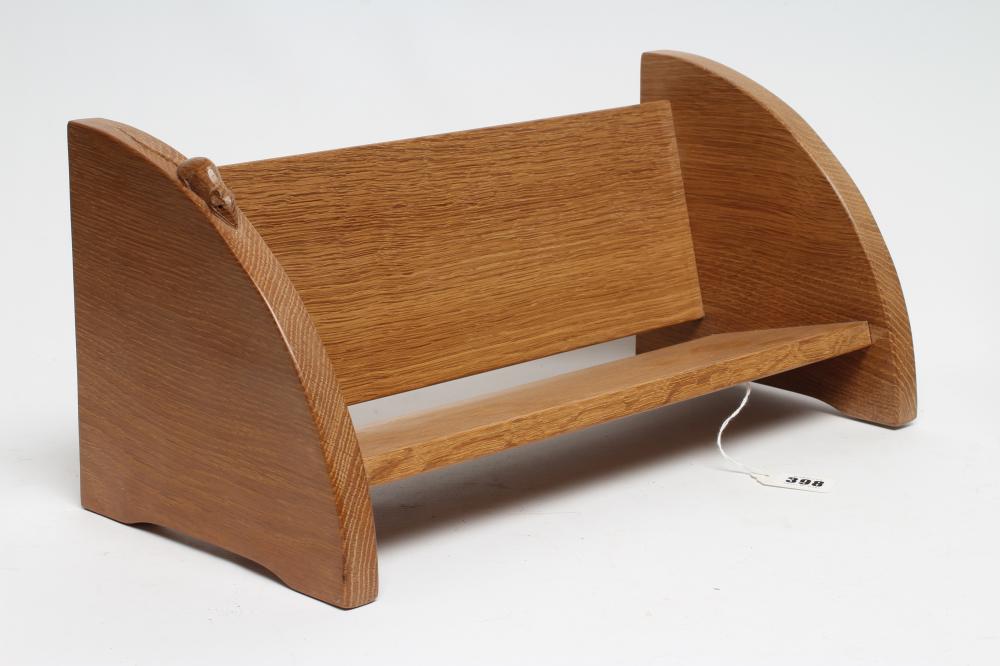 A ROBERT THOMPSON ADZED OAK BOOK TROUGH of oblong form Image