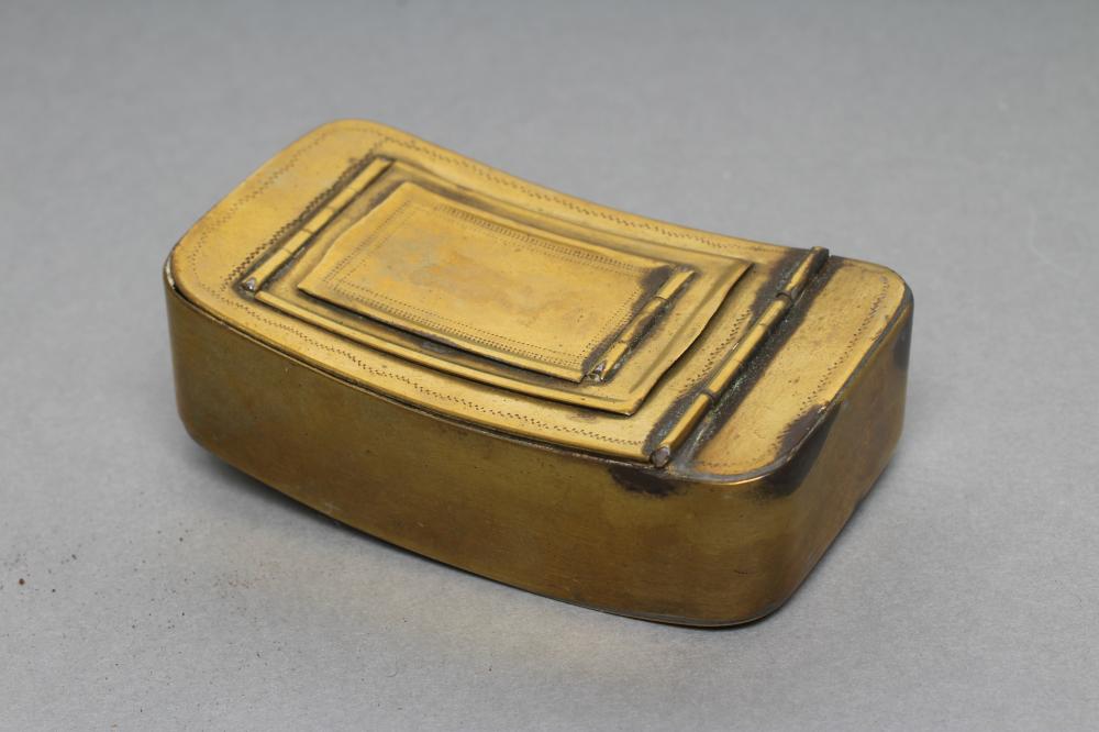 A GEORGIAN BRASS DOUBLE HINGED SNUFF/VESTA CASE of plain rounded oblong slightly concave form with Image